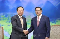 Премьер-министр Фам Минь Тьинь принял министра здравоохранения Лаоса