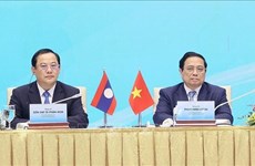 Премьер-министры Вьетнама и Лаоса сопредседательствуют на двусторонней конференции по инвестиционному сотрудничеству в Ханое