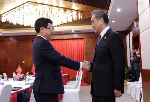 Вице-премьер Фам Бинь Минь провел двусторонние встречи с министрами Китая и Лаоса hinh anh 1