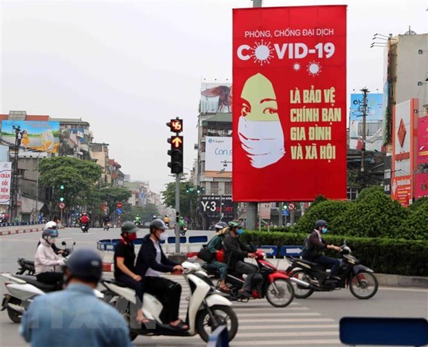 Правительство Вьетнама получило высокую поддержку населения в работе по профилактике и борьбе с COVID-19 hinh anh 1