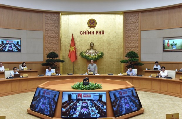 Премьер-министр провел онлаин-встречу по поводу ответа COVID-19 hinh anh 1