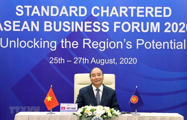 Премьер-министр принял участие в бизнес-форуме АСЕАН Standard Chartered 2020 hinh anh 1
