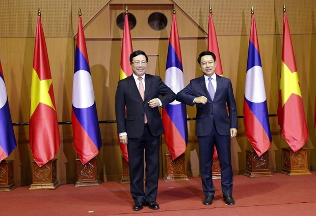Вьетнам и Лаос провели политические консультации на уровне министров иностранных дел hinh anh 1