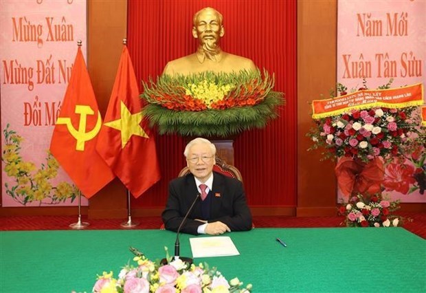 Руководители партии Вьетнама и Лаоса проводят телефонные переговоры hinh anh 1