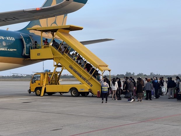 Vietnam Airlines усиливает меры по профилактике COVID-19 во время Тэт hinh anh 1