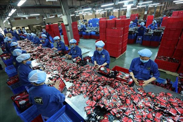 Oxford Economics: Роль глобального производственного центра в стимулировании роста Вьетнама hinh anh 1