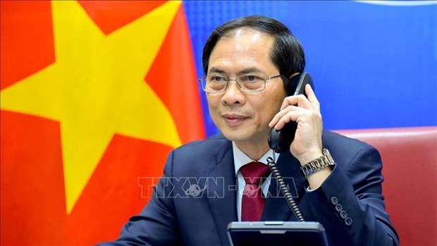 Телефонныи разговор министров иностранных дел Вьетнама и Китая hinh anh 1