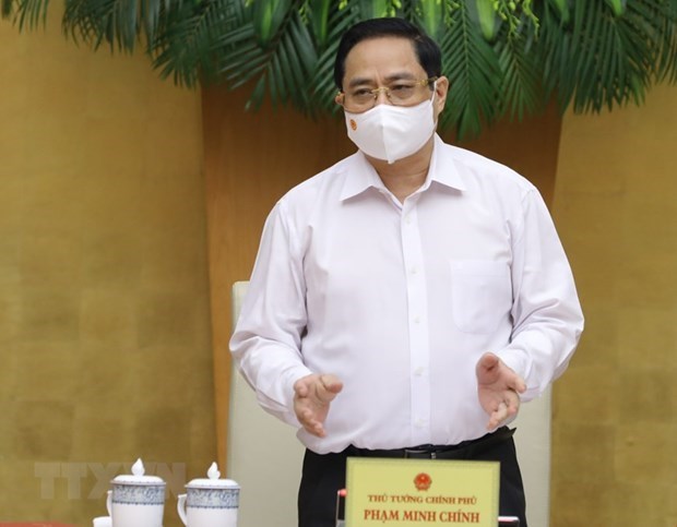 Премьер-министр Фам Минь Тьинь провел первое очередное заседание правительства hinh anh 1