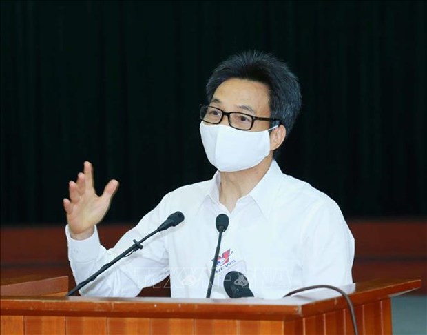 Заместитель премьер-министра: Правительство призывает неукоснительно выполнять меры по предотвращению эпидемии COVID-19 hinh anh 2