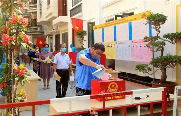Всеобщие выборы: международные СМИ: вьетнамские избиратели идут на выборы в антиэпидемических условиях hinh anh 1