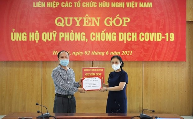 Вьетнамскии союз организации дружбы собирает средства для Фонда профилактики и контроля COVID-19 hinh anh 1