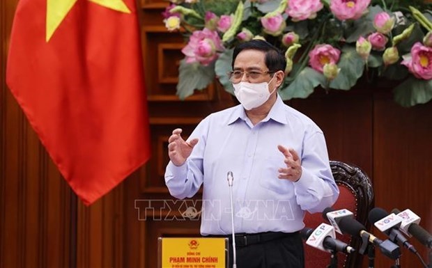 Премьер-министр Фам Минь Тьинь председательствует на маиском очередном заседании правительства hinh anh 1