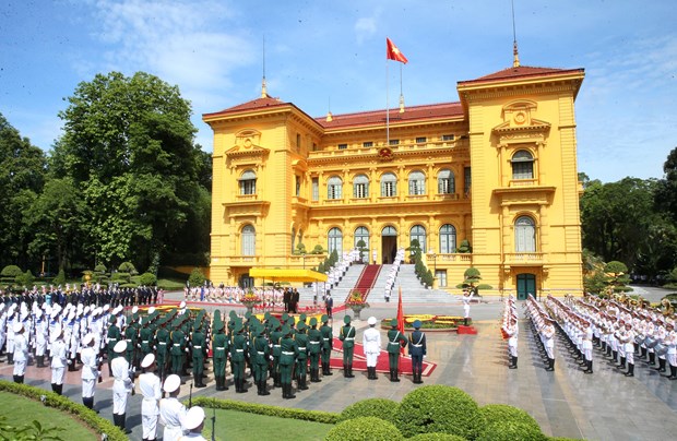 В Ханое состоялась официальная церемония встречи Генерального секретаря, президента Лаоса hinh anh 1