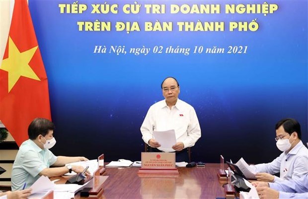 Президент Нгуен Суан Фук встретился с предпринимателями-избирателями в Хошимине hinh anh 1
