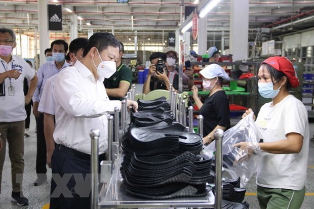 Хошимин: более 38.000 рабочих в Pouyuen Vietnam вернулись к работе hinh anh 1