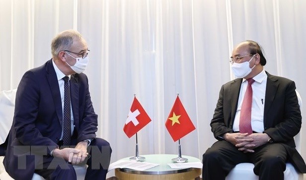 Потенциал и возможности от официального визита президента страны Нгуен Суан Фука в Швеицарию hinh anh 1