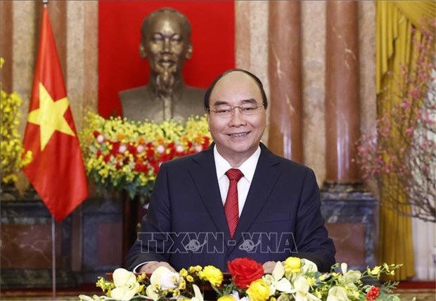 Президент Нгуен Суан Фук поздравляет вьетнамцев с Новым Лунным годом 2022 hinh anh 1