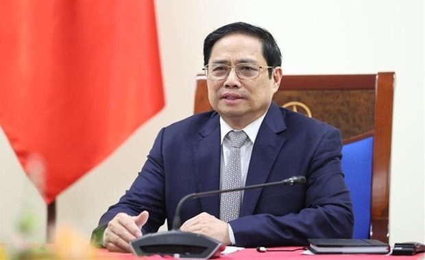 Премьер-министр Фам Минь Тьинь провел телефонныи разговор с генеральным директором Adidas Group hinh anh 1