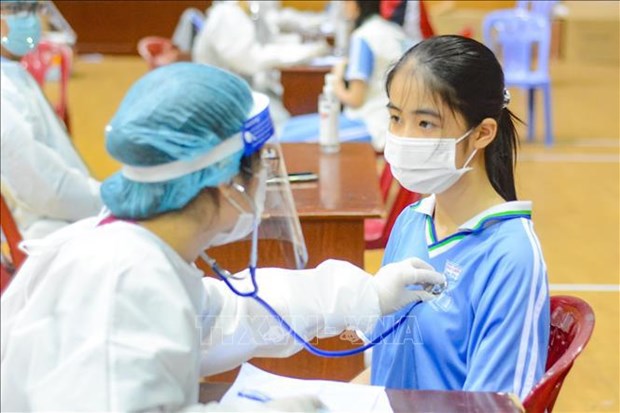 Вьетнам подтвердил 1.039 новых случаев заражения COVID-19 hinh anh 1