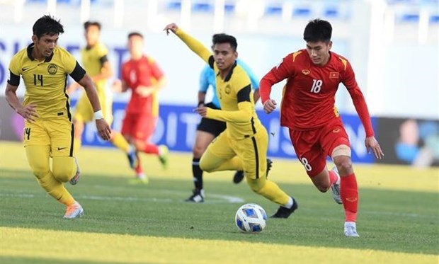 Вьетнам обыграл Малаизию со счетом 2:0 и вышел в четвертьфинал Кубка Азии до 23 лет hinh anh 1