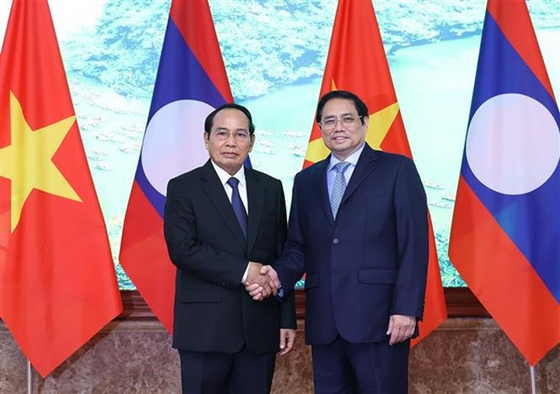 Премьер-министр Фам Минь Тьинь принял вице-президента Лаоса hinh anh 1