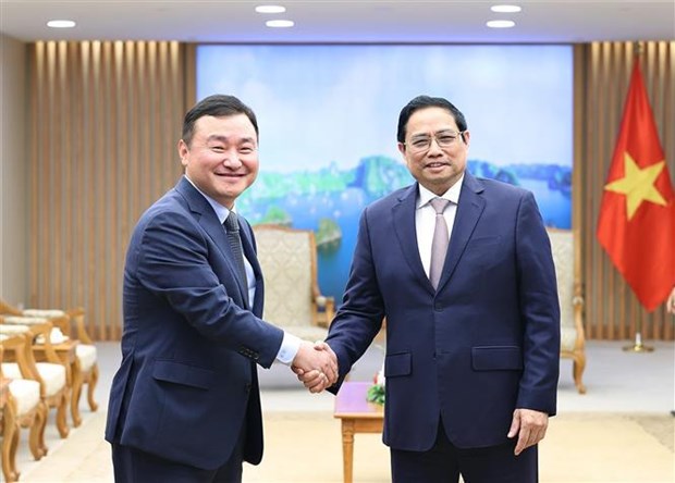 Премьер-министр Фам Минь Тьинь принял генерального директора Samsung Electronics Group hinh anh 1