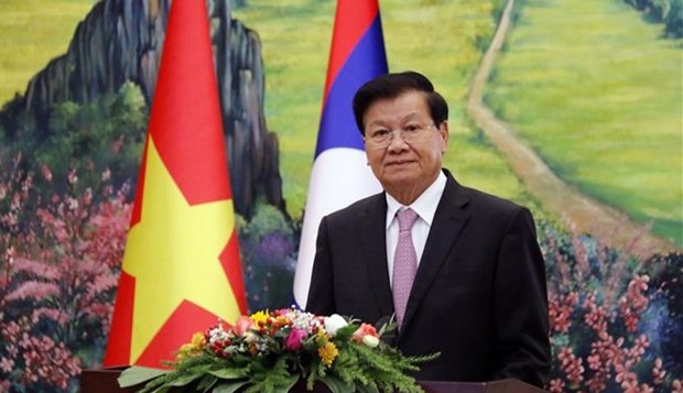 60-летие вьетнамско-лаосских отношении: Руководитель Лаоса призывает продолжать защищать и развивать особые отношения hinh anh 1