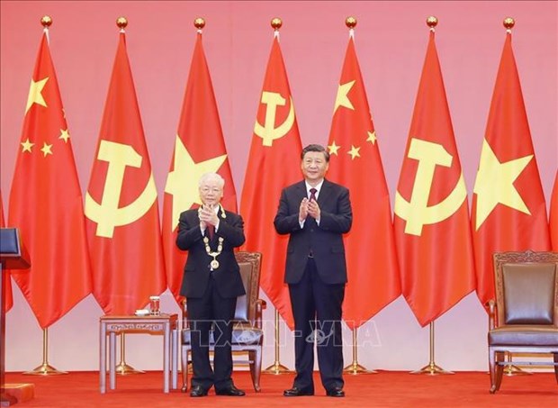 Генеральныи секретарь Нгуен Фу Чонг награжден орденом Дружбы КНР hinh anh 1