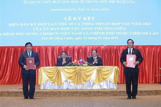 Премьер-министр Фам Минь Тьинь сопредседательствовал на 45-м заседании Вьетнамско-лаосскои межправительственнои комиссии hinh anh 2