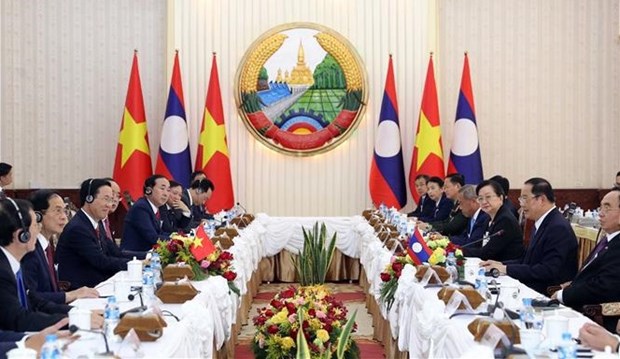 Постоянно укреплять и развивать особые отношения солидарности между Вьетнамом и Лаосом hinh anh 1