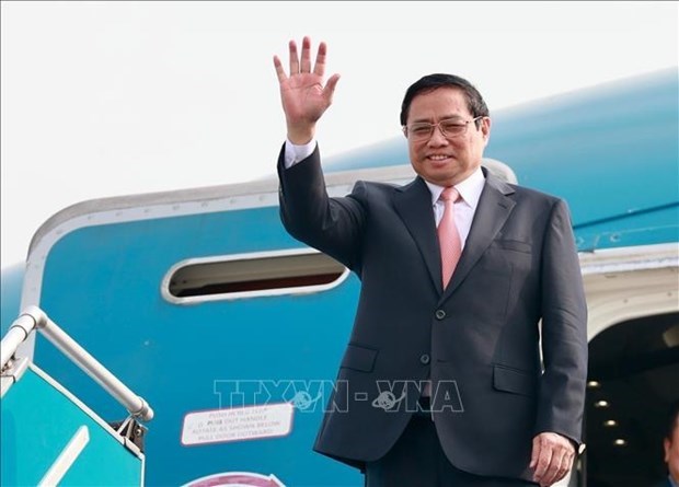 Премьер-министр Фам Тьинь отправляется для участие в расширенном саммите G7 hinh anh 1