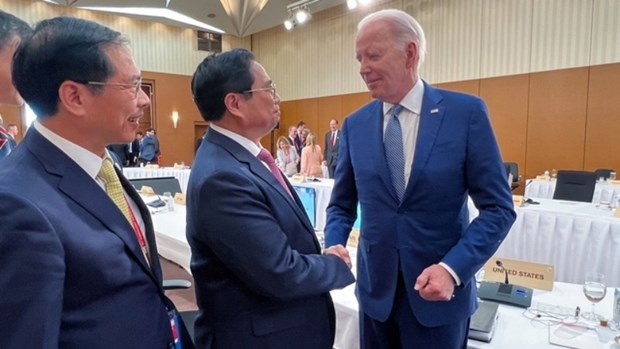 Премьер-министр Фам Минь Тьинь провел двусторонние встречи с президентом США и председателем Европеиского совета hinh anh 1