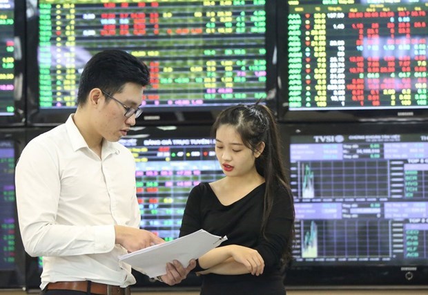 Вьетнам преодолевает препятствия на пути модернизации фондового рынка hinh anh 1