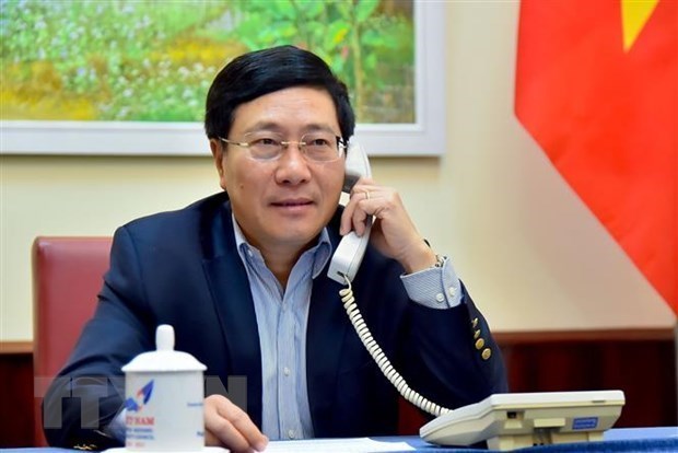 Состоялись телефонные переговоры министров иностранных дел Вьетнама и Германии hinh anh 1