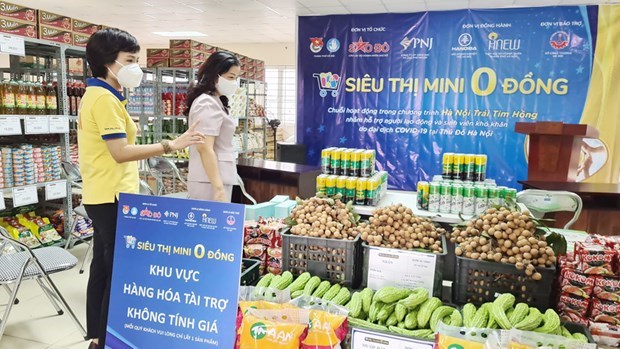 Магазины «0 донгов» поддерживают людеи, пострадавших от пандемии, в Ханое hinh anh 1