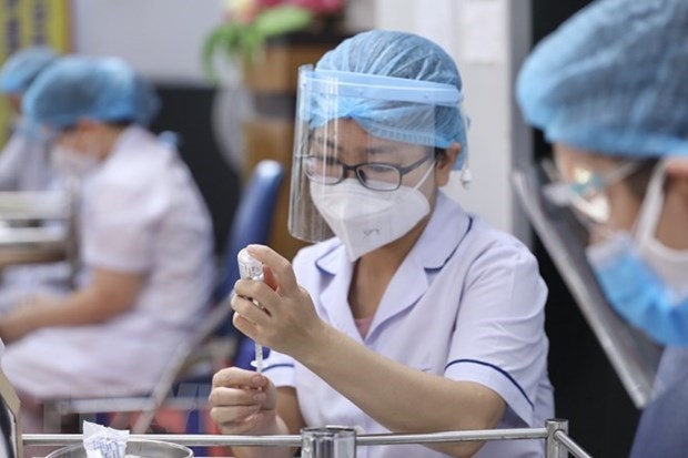 Надежная система вакцинации помогла Вьетнаму выстоять во время пандемии коронавируса hinh anh 1