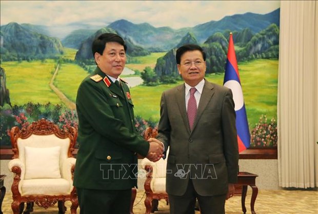 Руководители партии и государства Лаоса приняли делегацию высокопоставленных политических кадров Вьетнамскои народнои армии hinh anh 1
